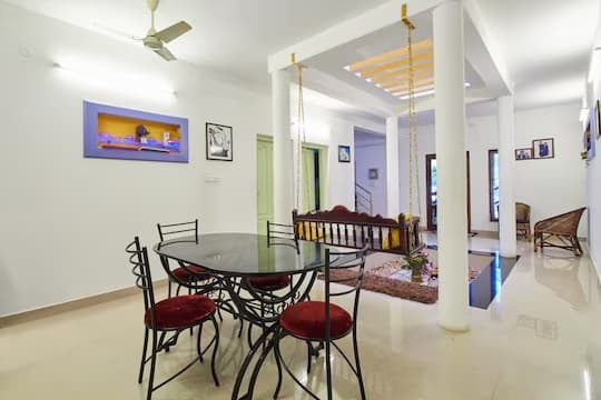 Spacious traditional Kerala dining area for guests
